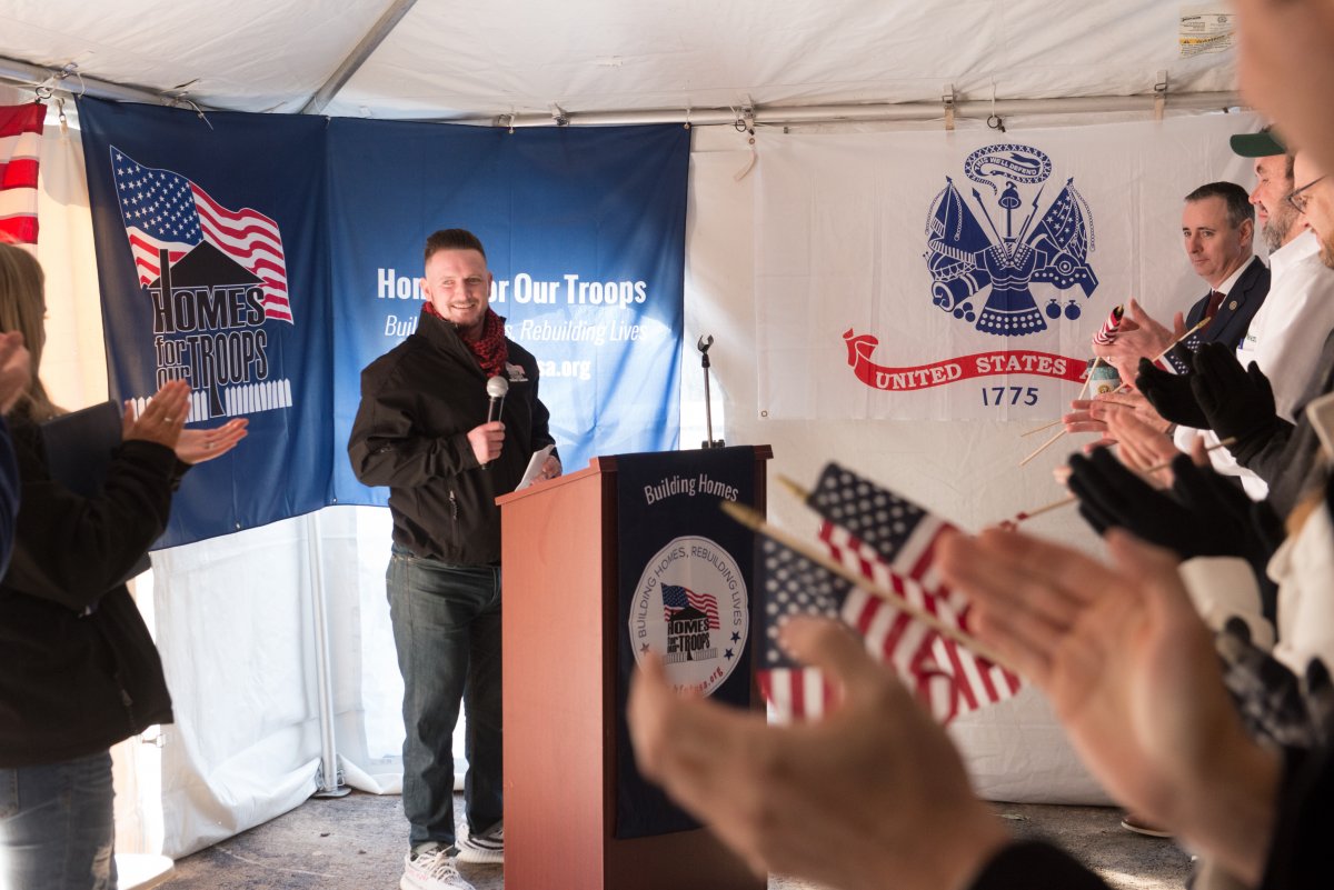corporal kevin mccloskey gives a speech at the homes for troops key ceremony