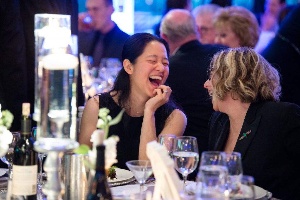 two women laughing at fox chase wine auction