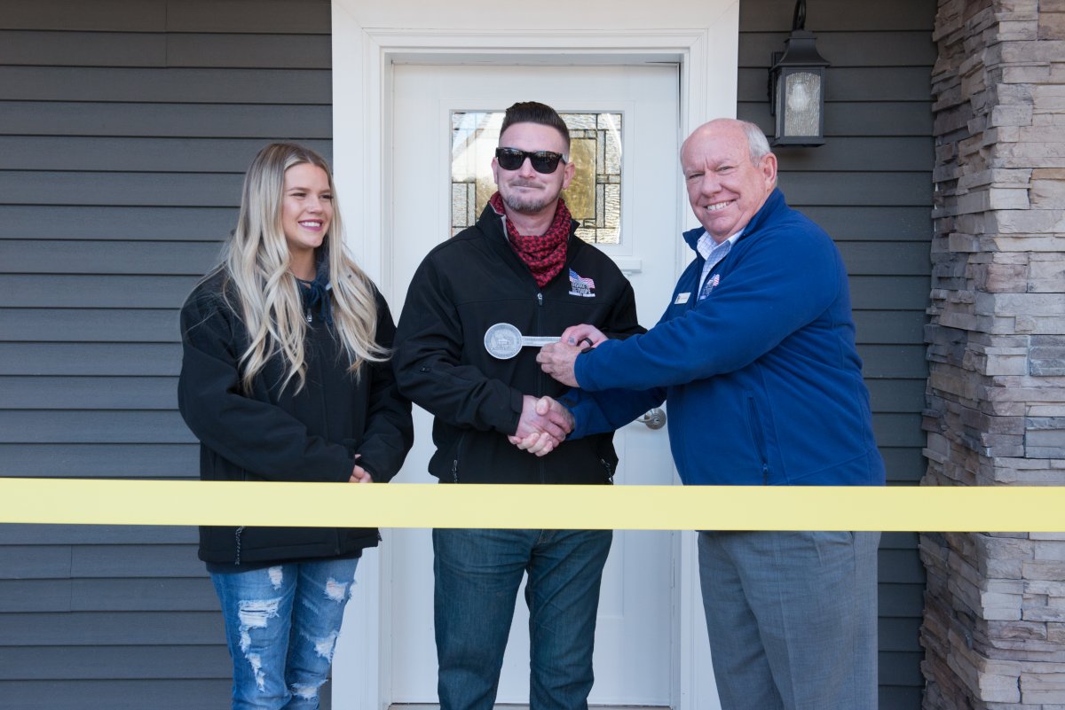 corporal kevin mccoskey ribbon cutting at the homes for troops key ceremony