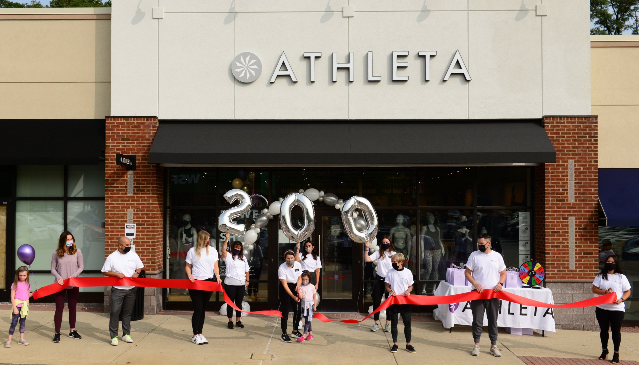 ribbon cutting for athleta store, event photography during covid-19