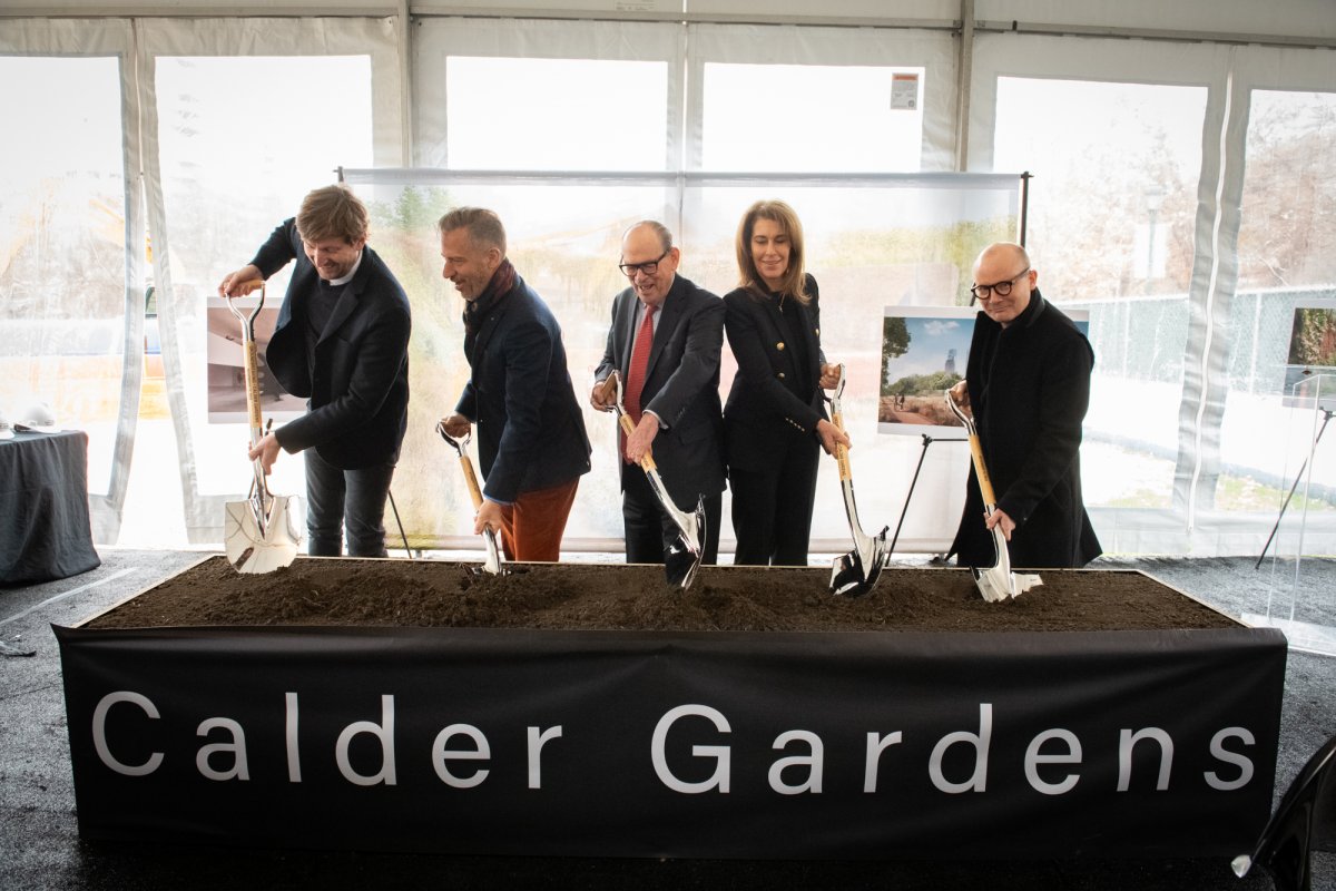 Important attendees at the Calder Gardens groundbreaking ceremonially dig the first few shovelfuls of dirt.